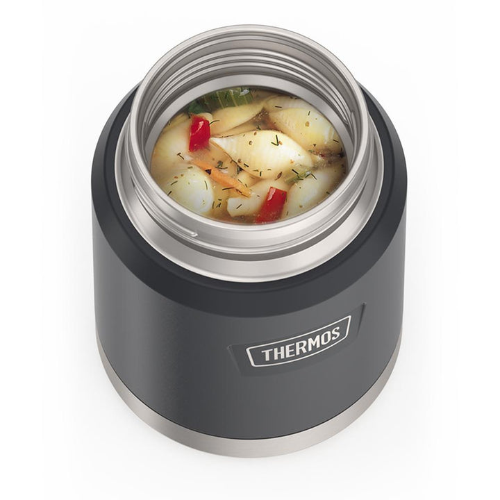 16 ounce Thermos Food Jar with stainless steel spoon, top view, lid off and soup inside, Granite Black.
